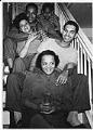 Image of Group sitting on stairs at a party, Seattle, July 16, 1944