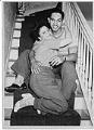 Image of Lester Catlett and woman on stairs at a party, Seattle, July 16, 1944