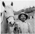 Image of Portrait of a man with a horse at a ranch, circa 1950