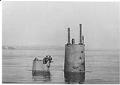 Image of USS N.1 Top of submarine emerging from water,  Seattle Construction & Dry Dock Co., circa 1917