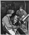 Image of George Dunlap training Herb Johnson and Jack Ferris, In-Plant Training Department at Todd Pacific Shipyards, Seattle Division, circa 1945