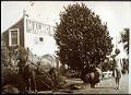 Image of Young woman and horse outside Malmo & Co. warehouse, Seattle, circa 1925