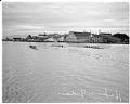 Image of Indigenous canoes and Husky crew shell racing, La Conner, November 29, 1941