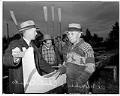 Image of Charlie Edwards and Al Ulbrickson standing by canoe 