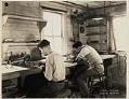 Image of Two men working on hydroplane models in Boeing’s model making shop, October 29, 1929