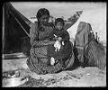 Image of Makah woman and child with puppy, Port Townsend, circa 1900
