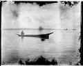 Image of Coast Salish canoe in Port Townsend Bay, circa 1900