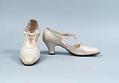 Image of White kid leather shoes with strap through two loops, ca. 1924