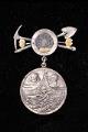 Image of Pin commemorating the Alaska-Yukon-Pacific Exposition (AYPE) held in Seattle, 1909