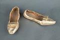 Image of Pair of gold leather slippers, worn as part of Century 21 Seattle World's Fair Fashion Show, 1962