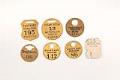 Image of Collection of theater coat check tags, ca. 1900-1950