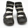 Image of Pair of black leather shoes with four buttons, ca. 1910s