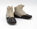 Image of Black and white button shoes, ca. 1900-1920