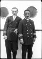 Image of Captain D. Fuchigami and another man on board ship, Seattle, circa 1925