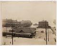 Image of Pacific Coast Steamship Company piers with Columbia & Puget Sound Railroad passenger depot and team tracks, Seattle, circa 1904