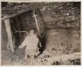 Image of Man using pneumatic drill in Issaquah mine, circa 1915