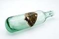 Image of Green glass soda bottle from Pacific & Puget Sound Bottling Company, Seattle, early 1900s