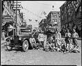 Image of Chinese dance group with decorated car on King Street, May 1921