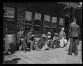 Image of Group of Suquamish people waiting at Colman Dock, Seattle, circa 1911