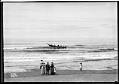 Image of Quinault canoe and sightseers, Moclips, Washington, 1914