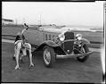 Image of Olympic runner Ed Genung and Chevrolet automobile, February 18, 1932