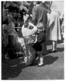 Image of Little girl hugging a giant stuffed toy panda, Seattle World's Fair, 1962