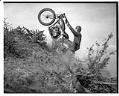 Image of Man riding Indian motorcycle, 1934