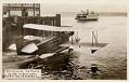 Image of Gorst Air Transport seaplane with ferry in background, Seattle, circa 1933