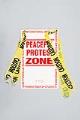 Image of Poster and yellow caution tape from the World Trade Organization (WTO) protest, 