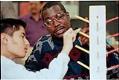 Image of Ray Seales working with student Giac Nguyen at Lincoln High School, Tacoma, March 7, 1997