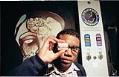 Image of Project ACTION member near condom dispenser, Seattle, April 3, 1997