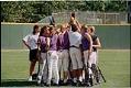 Image of University of Washington women's softball team in huddle, Seattle, May 13, 1997