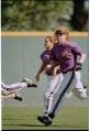 Image of Sara Pickering running off baseball field, Seattle, May 13, 1997