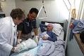 Image of Prison medical staff changing patient's bandages at Monroe Correctional Complex, August 14, 2002