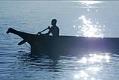 Image of Long Tall (Chippewa) paddling a traditional cedar canoe, Redondo Beach, August 2002