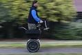 Image of Troy Stockwell riding on a Segway, Seattle, October 7, 2002