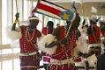 Image of Mayen Akoon leading Sudanese dancers, October 20, 2002