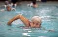 Image of Jeanne Wharnsby and others enjoying YWCA pool, Seattle, December 13, 2002