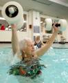 Image of Lucy Tripp participating in water aerobics class at YWCA, Seattle, December 13, 2002