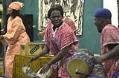 Image of Souleymane N'Diaye and others drumming and dancing at Adefua performance, Seattle, December 2002