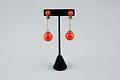 Image of Orange costume earrings, ca. 1971