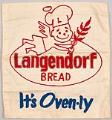 Image of Patch of embroidered cloth, probably for an apron, with the Langendorf Bread company logo and the motto, 