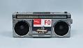 Image of Boom box with Fed Ex sticker, owned and used by Rob Castro (R.B. Cummings), ca. 1990s