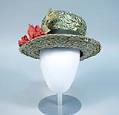 Image of Green straw hat with flower, made by John Eaton, 1960s