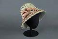 Image of Green and brown straw hat, made by Izzie Lewis, ca. 1990s