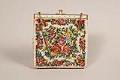 Image of White purse with needlepoint flower design, ca. 1940s