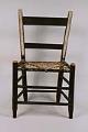 Image of One of a pair of slat back side chairs with woven rawhide seats, once owned by the Mercer family, ca. 1850-1880