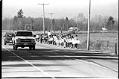 Image of Muckleshoot memorial and protest march alongside cars on Highway 164, February 27, 1991