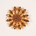 Image of Gold colored brooch with topaz rhinestones, ca. 1960s