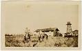 Image of Two young women on horses, with farmhouse in background, Seattle, circa 1930